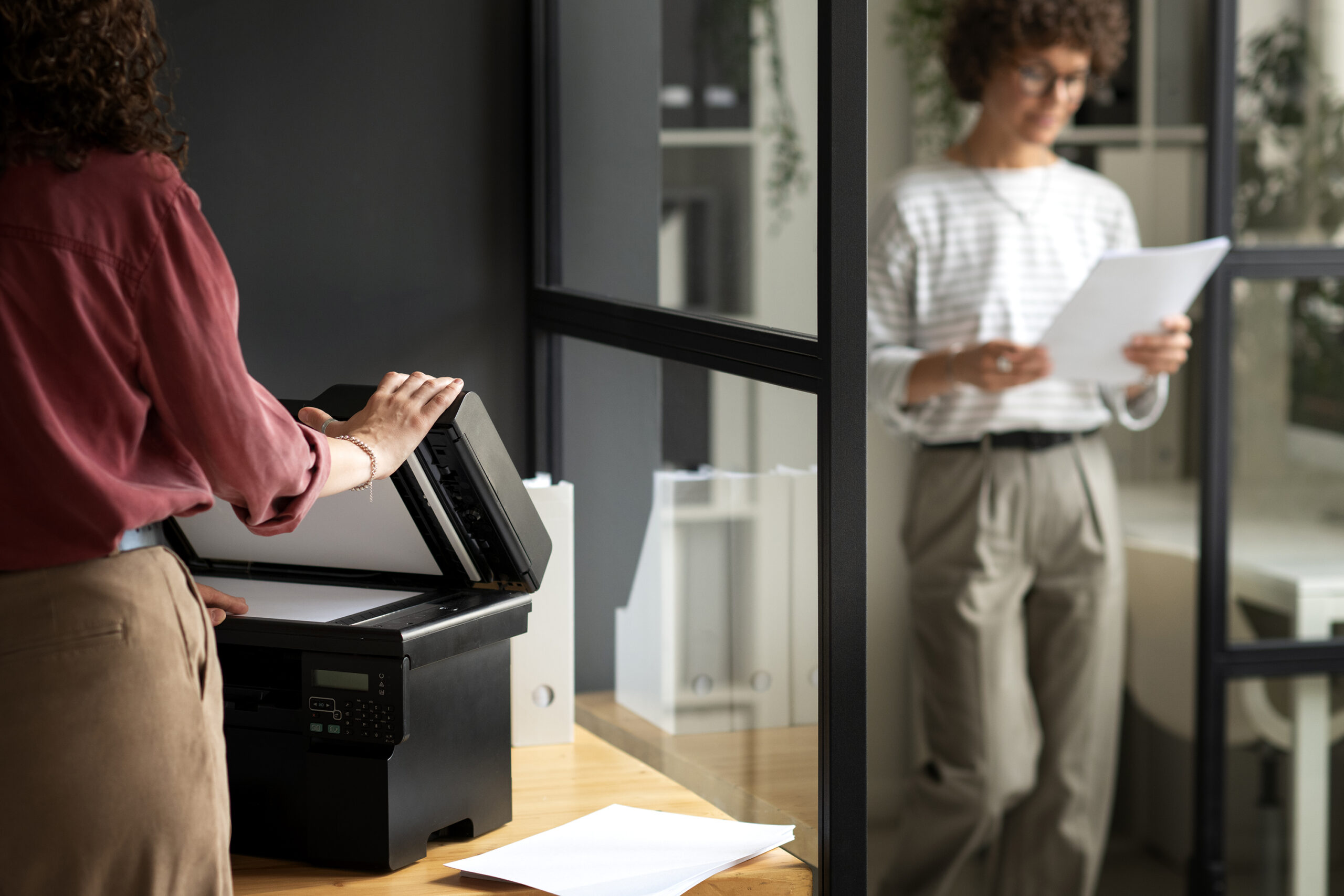side-view-woman-using-printer